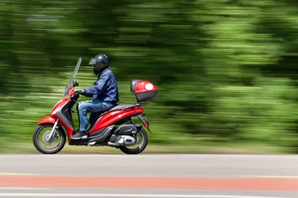 man zooming on a scotter